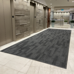 Linhas matting installed in an elevator lobby.